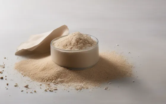 A glass bowl of pale fibrous husk powder with a spilled heap around it